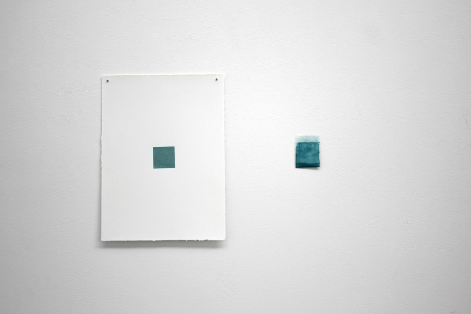 blue monochrome engraving and sachet of pigments shown on a wall