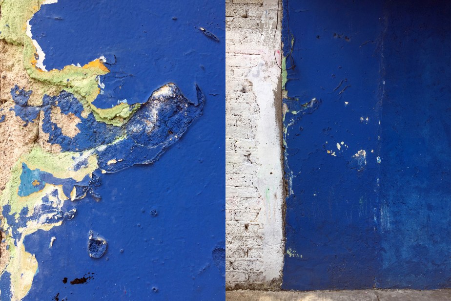 exterior wall painted blue with flaking paint