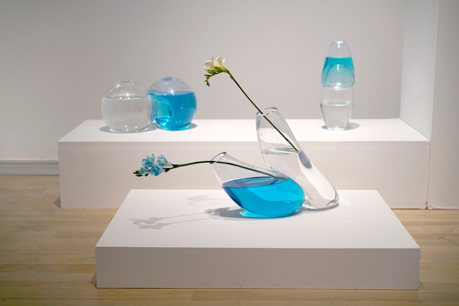 blown glass vases on plinths in an exhibition space