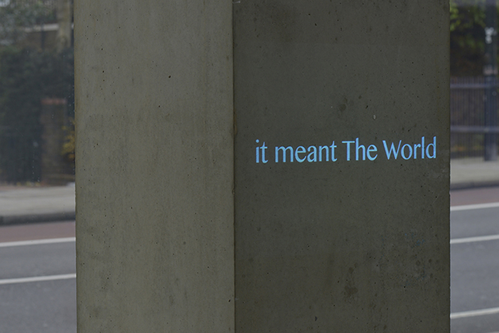text projection in blue light of the words it meant the world