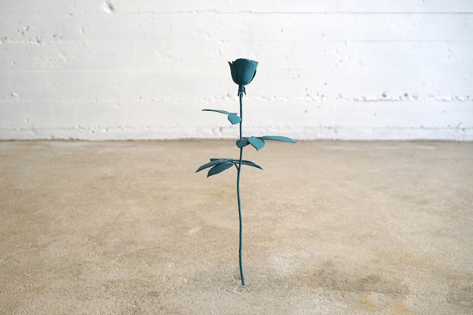 bronze casting of a rose painted with blue pigments