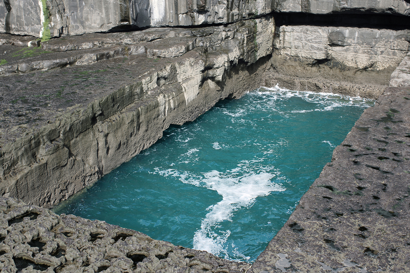 seaside rectangular pool naturally carved in a rock formation