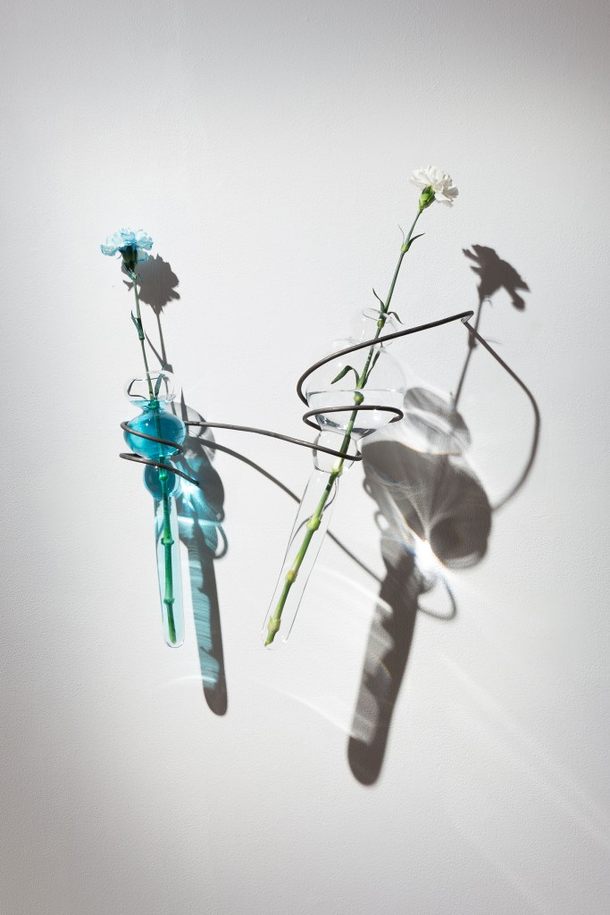 blown glass sculptures with flowers and blue pigments
