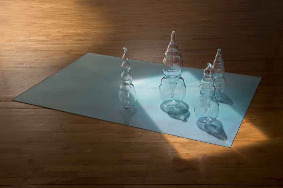 installation of blown glass sculpture with condensation on the ground