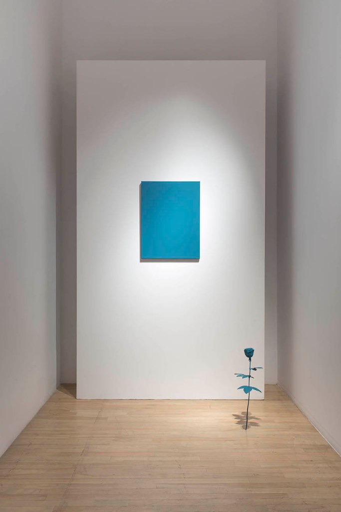 blue monochrome painting and blue rose sculpture